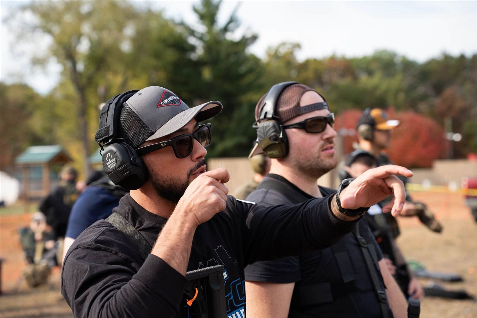 Range staff directing a relay